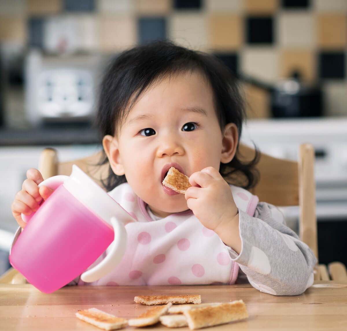 baby eating solid food