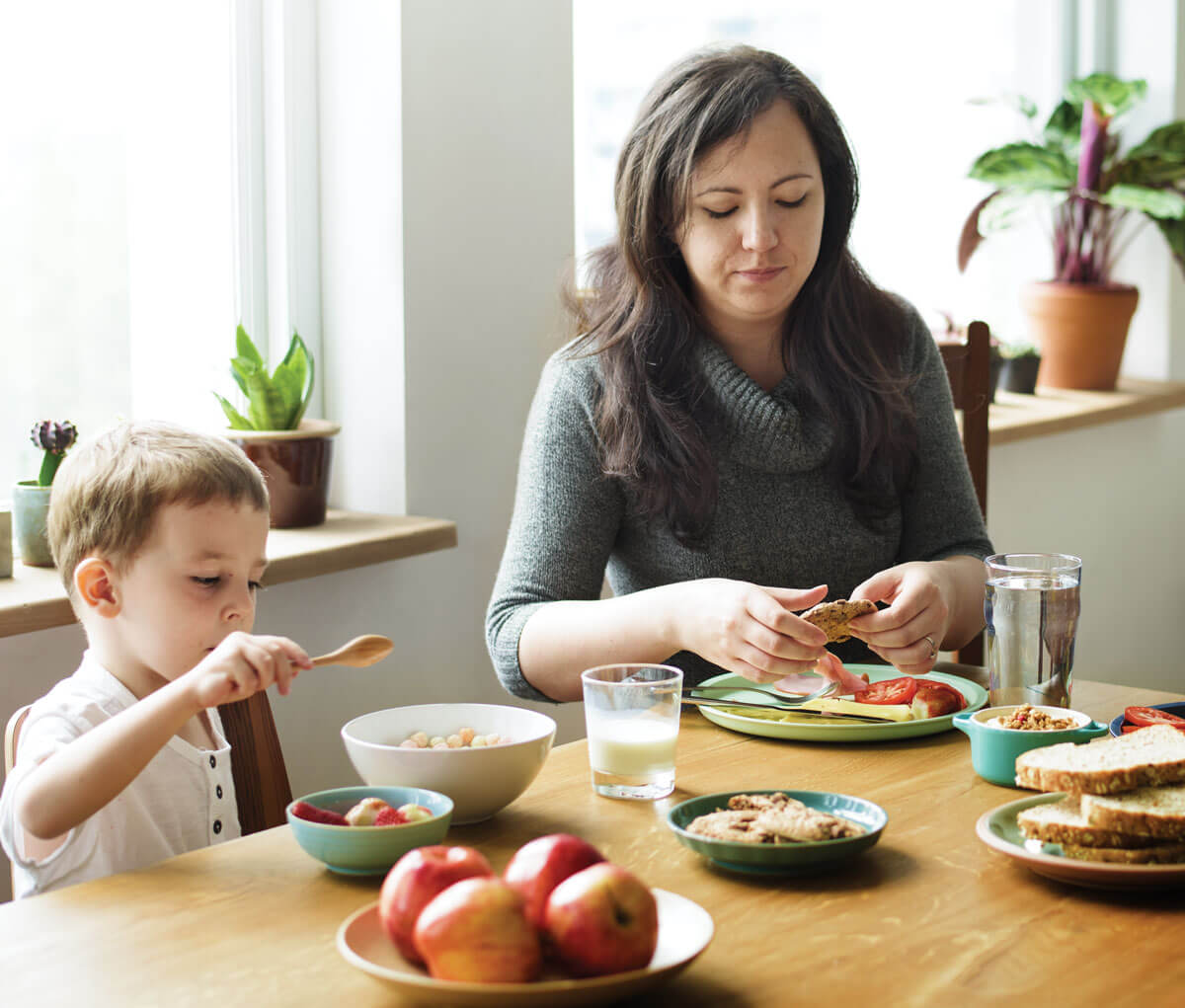 Mother and child enjoying a healthy breakfast together.