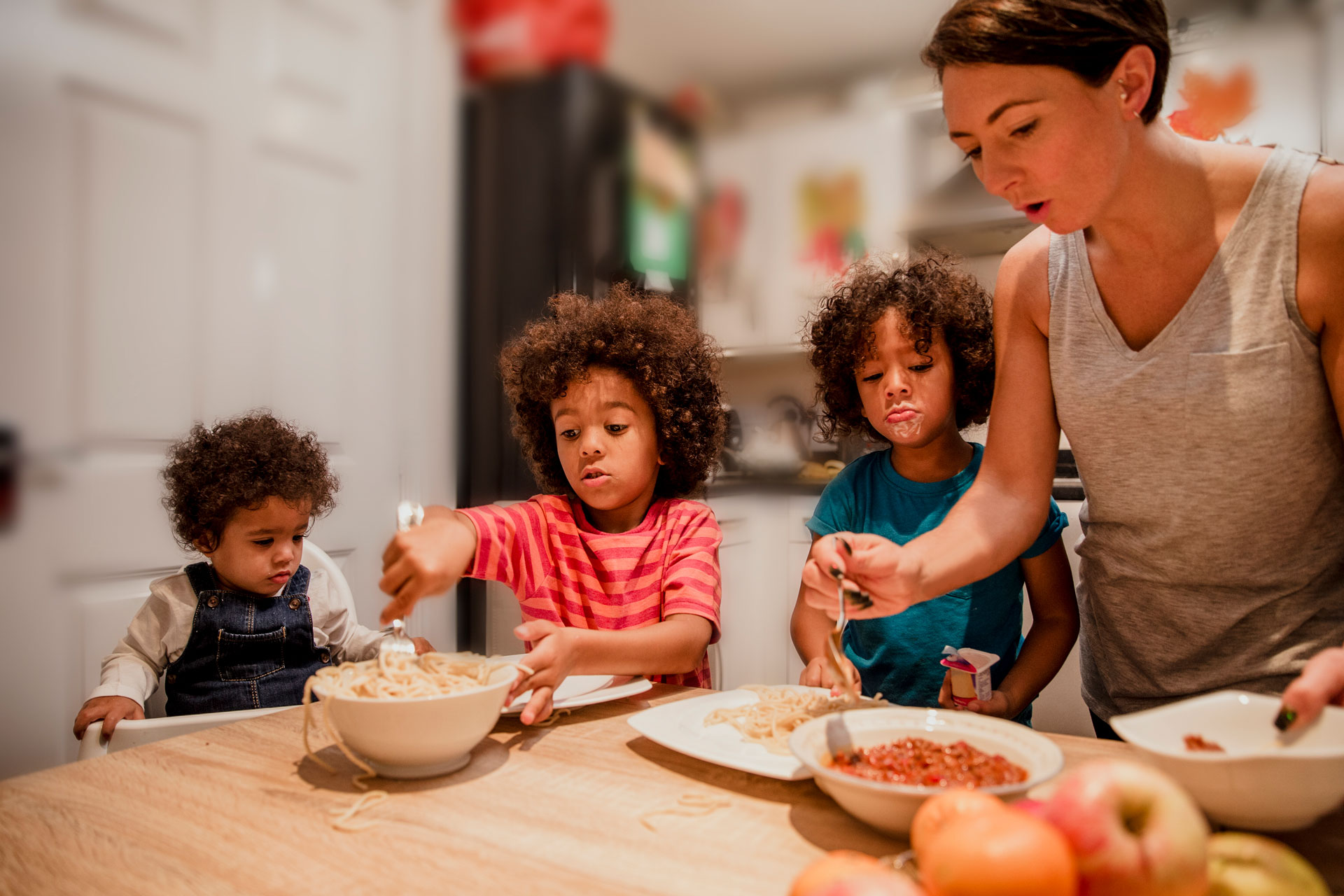 Family enjoying meal together at kitchen table.