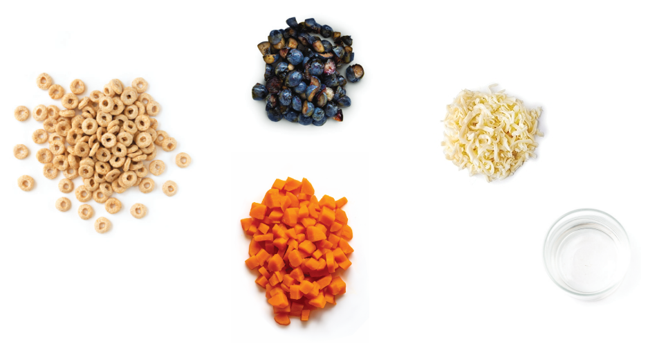 Cereal, blueberries, cheese, carrots, and water arranged separately.