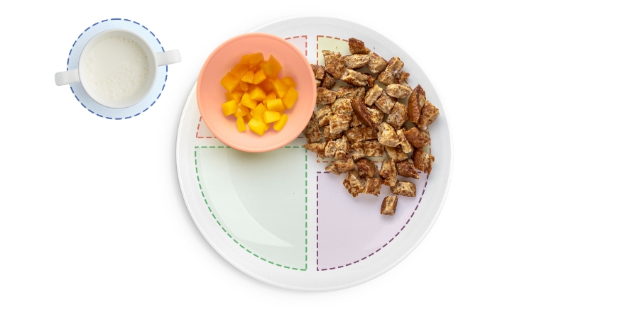 Divided plate with diced toast, cup of milk.