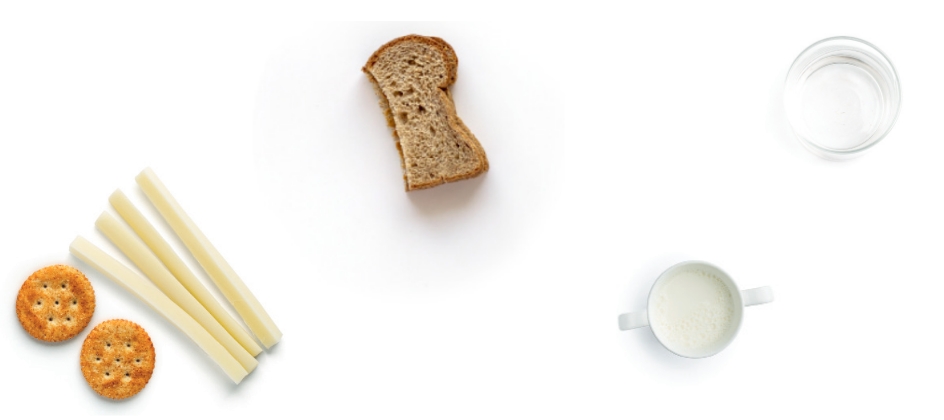 Crackers, cheese, bread, milk, and water on white background.