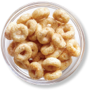 A clear bowl filled with cereal loops.