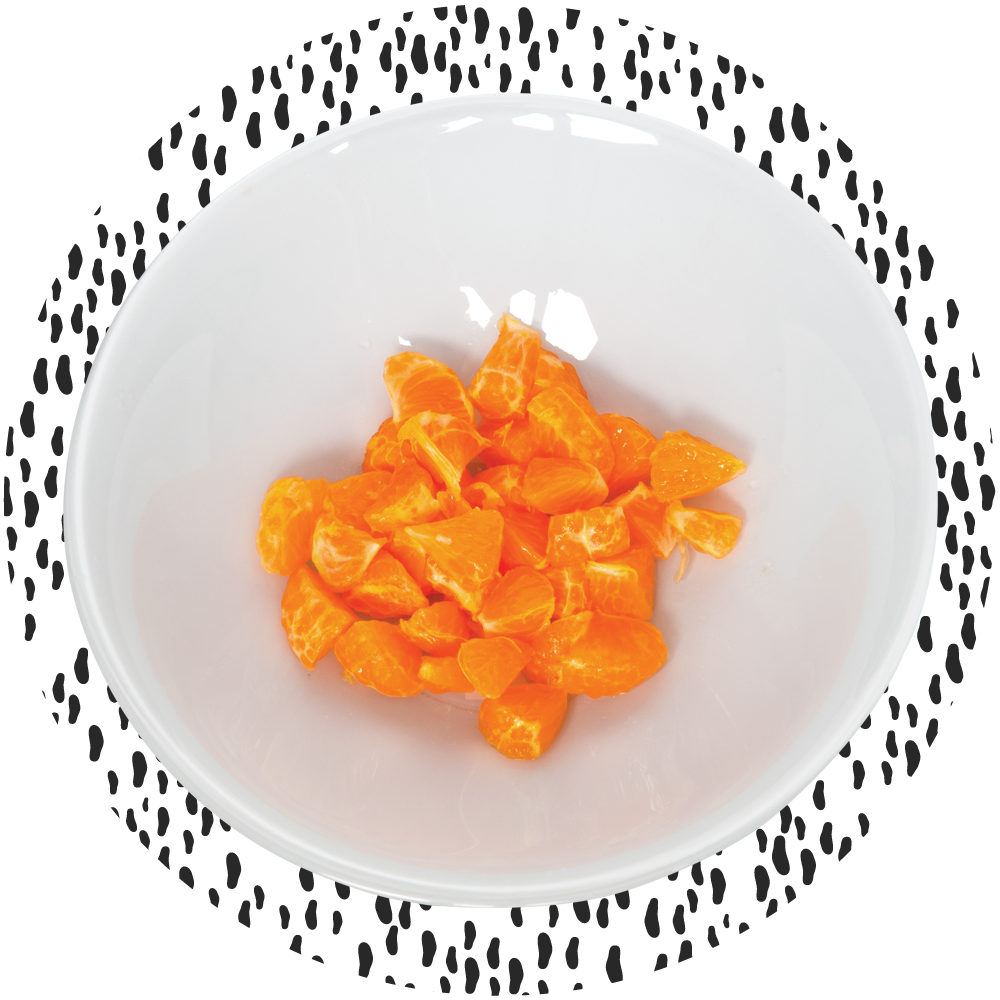 Orange slices in a white bowl.