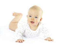 Baby in white outfit crawling on white surface.