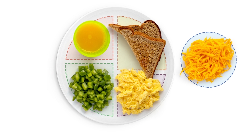 Balanced meal with toast, eggs, peppers, and juice.