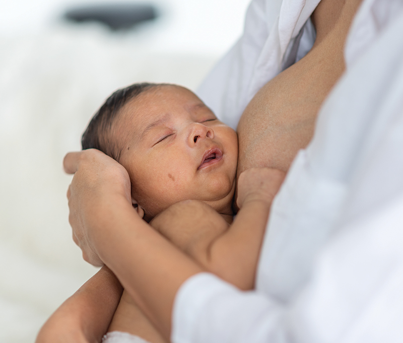 Sleeping baby in arms