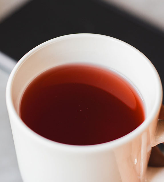 Cup of hot tea on a table.