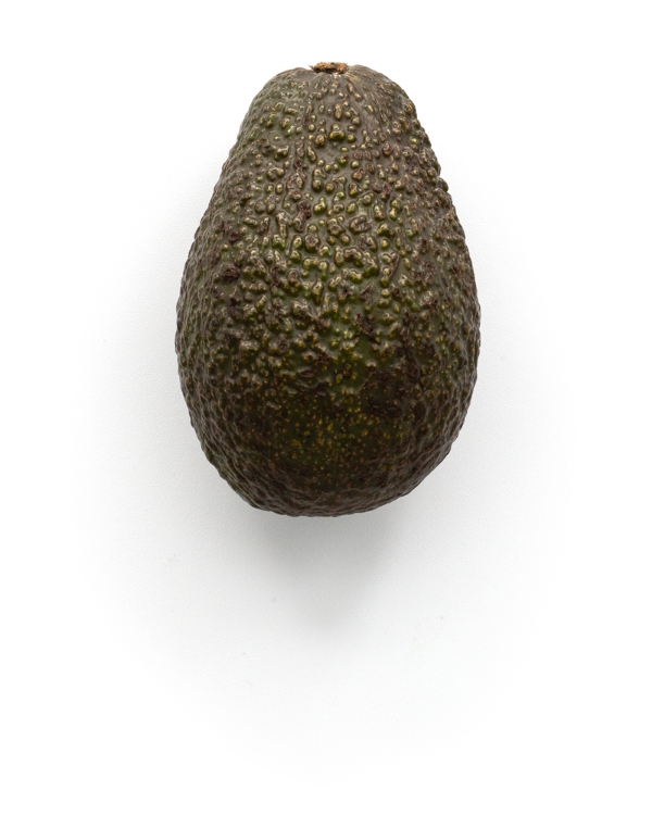 Whole avocado on white background.
